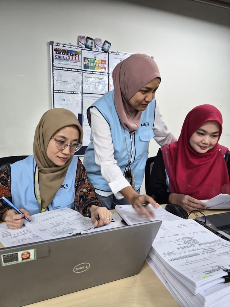 Team reviewing export and trade compliance documents